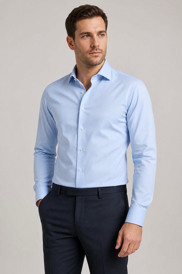 Man wearing a light blue formal shirt